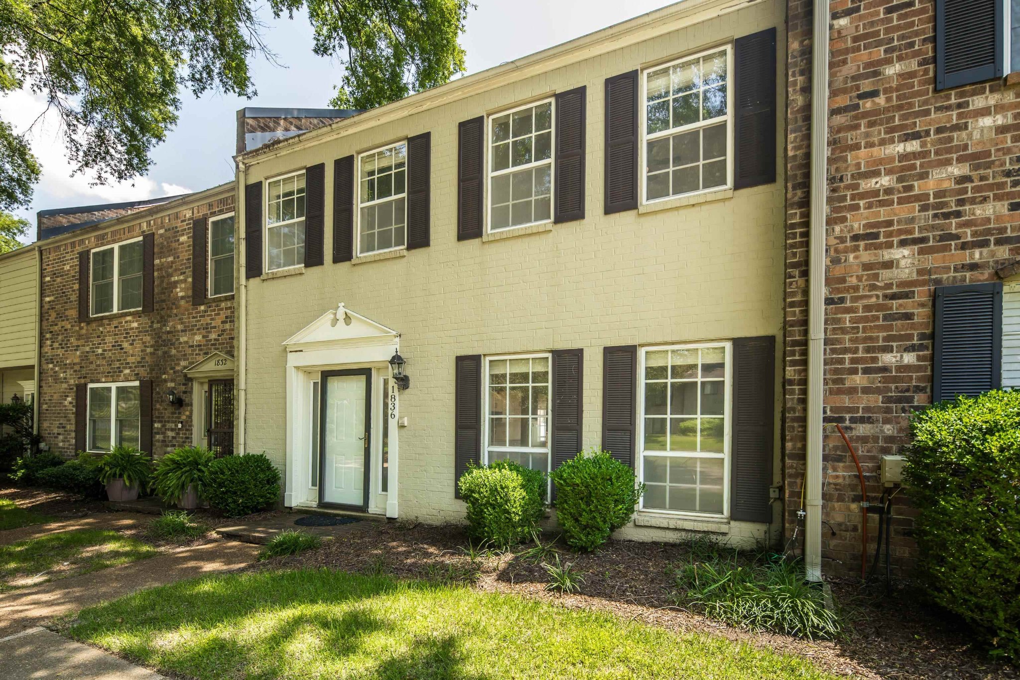 1836 Kimbrough Road Memphis, TN 38138 - Photo 3 of 16 a front view of a house having yard and potted plants