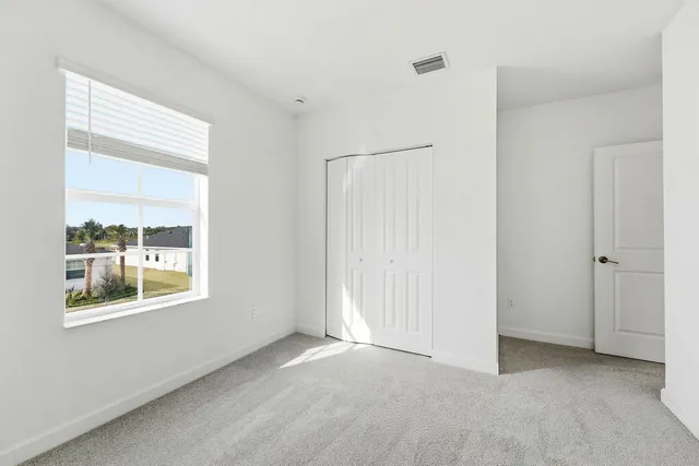 a bathroom with a sink a toilet a shower and a mirror