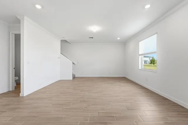 a view of an empty room with a window