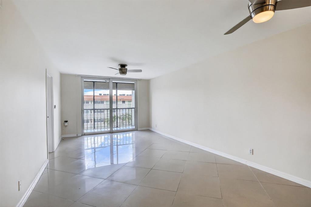 5321 Northeast 24th Terrace, Unit 504A Fort Lauderdale, FL 33308 - Photo 13 of 35 an empty room with floor to ceiling windows