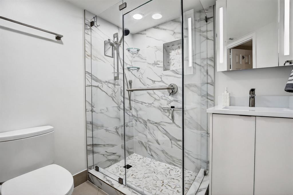 5321 Northeast 24th Terrace, Unit 504A Fort Lauderdale, FL 33308 - Photo 16 of 35 a bathroom with a shower toilet and sink