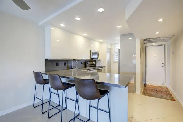 a view of a bathroom with sink dryer and washer