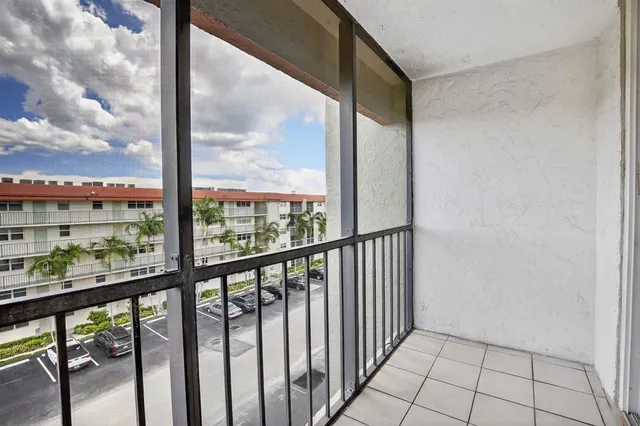 a view of a building with a yard