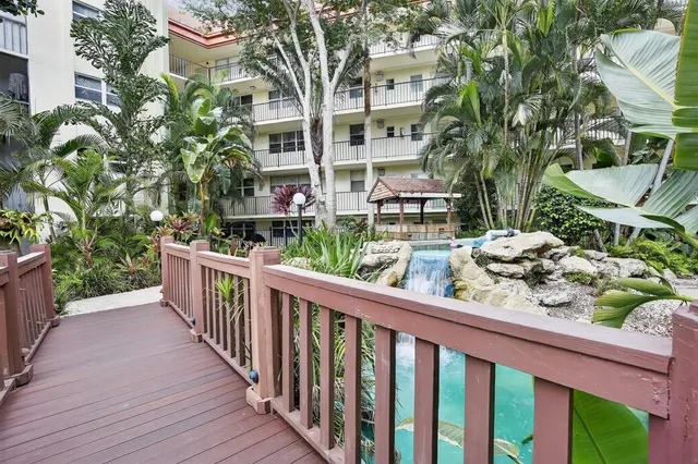 an empty room with closet and a ceiling fan