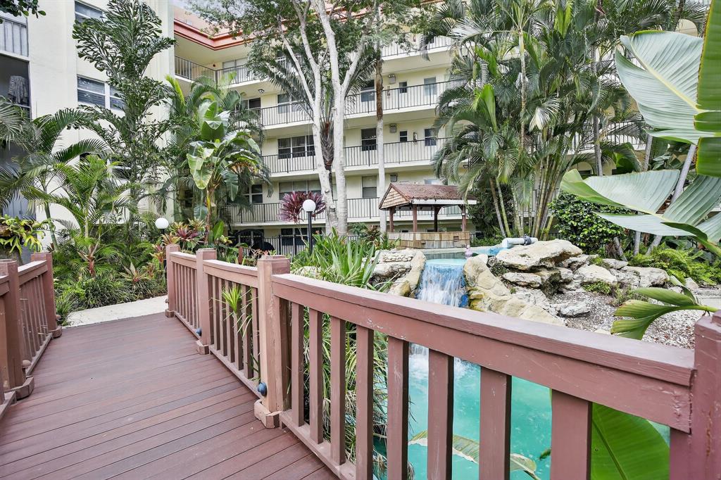 5321 Northeast 24th Terrace, Unit 504A Fort Lauderdale, FL 33308 - Photo 6 of 35 One of the walkways in the lush grounds.