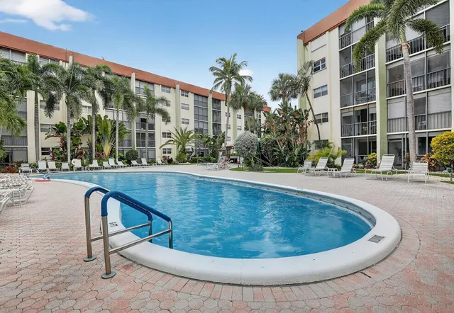 a bathroom with a shower a sink and a toilet