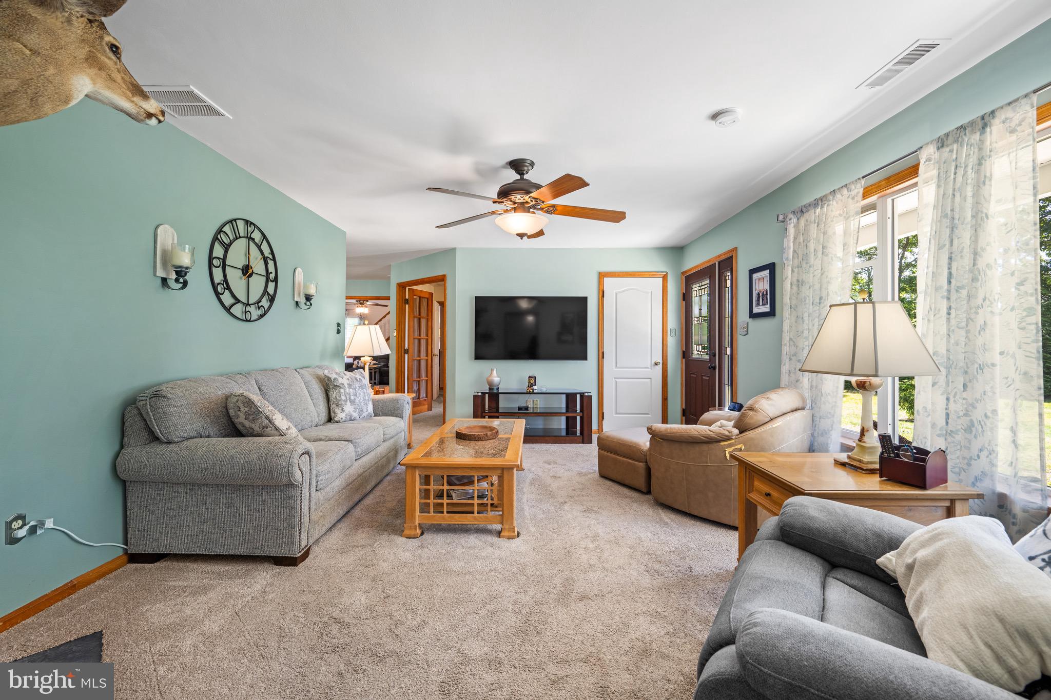 458 Radix Road Williamstown, NJ 08094 - Photo 10 of 48 a living room with furniture ceiling fan and a large window