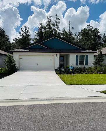 a view of house with yard