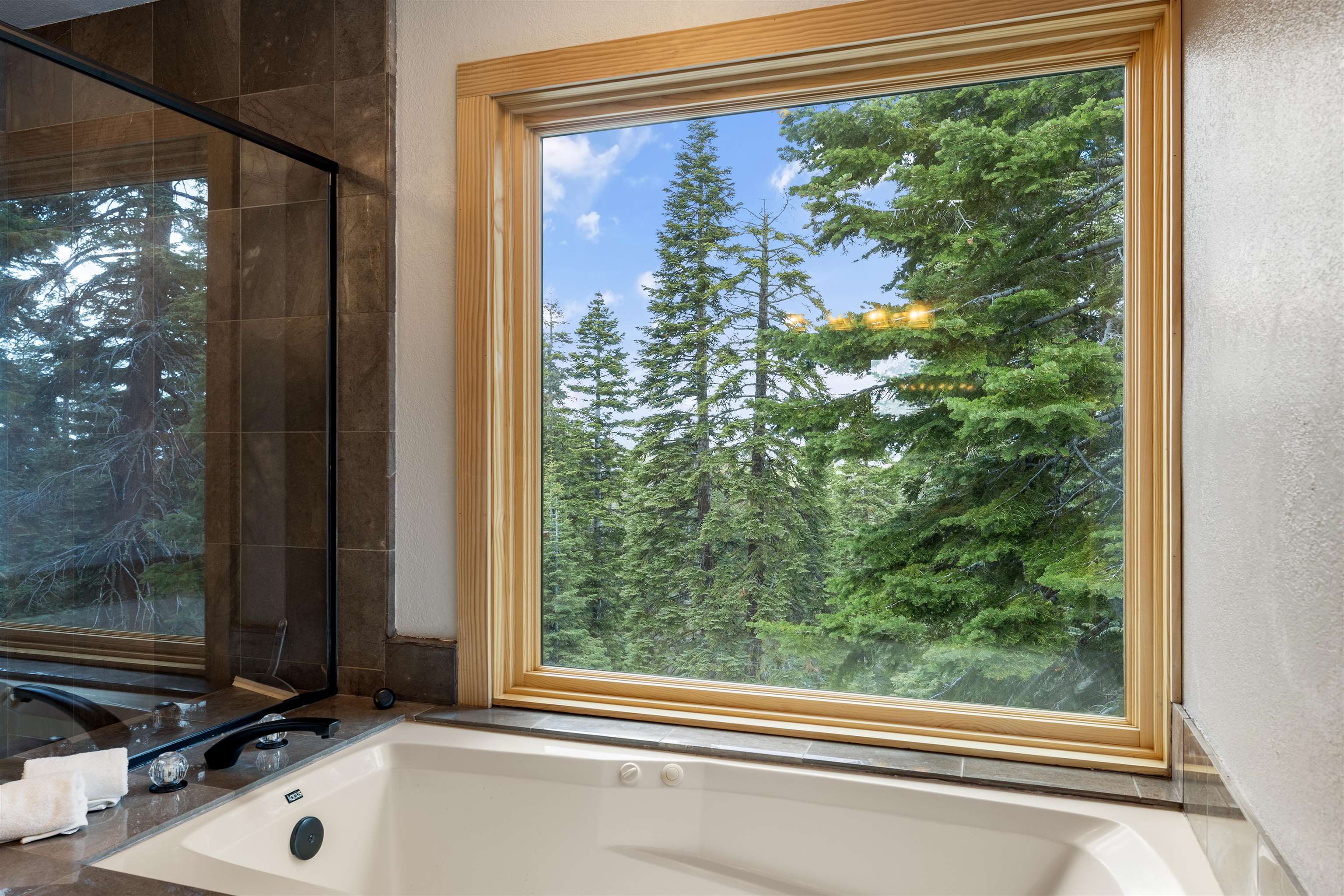 12185 Ski Slope Way Truckee, CA 96161 - Photo 12 of 27 a bathroom with a window and a sink