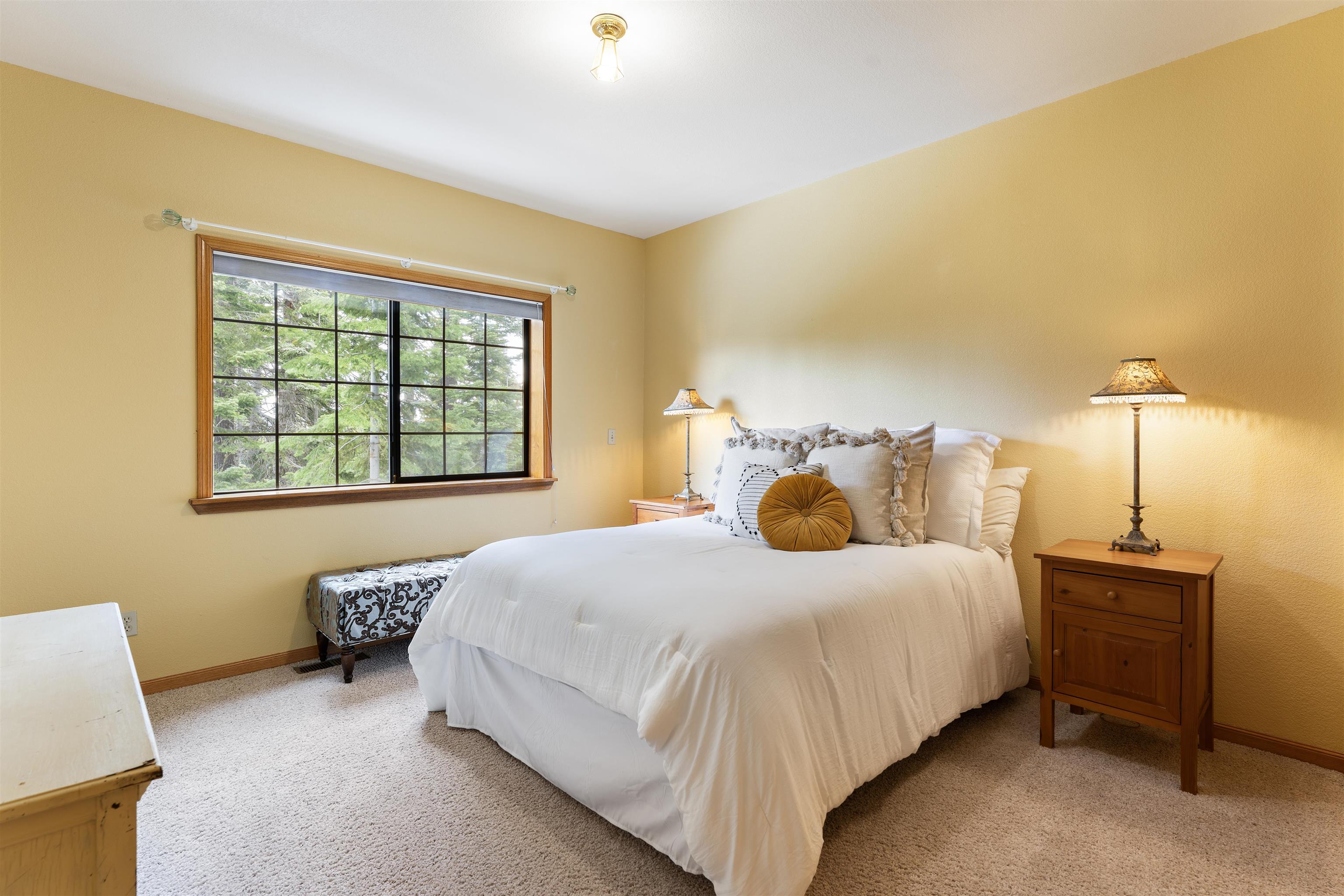 12185 Ski Slope Way Truckee, CA 96161 - Photo 19 of 27 a bedroom with a bed and a night stand