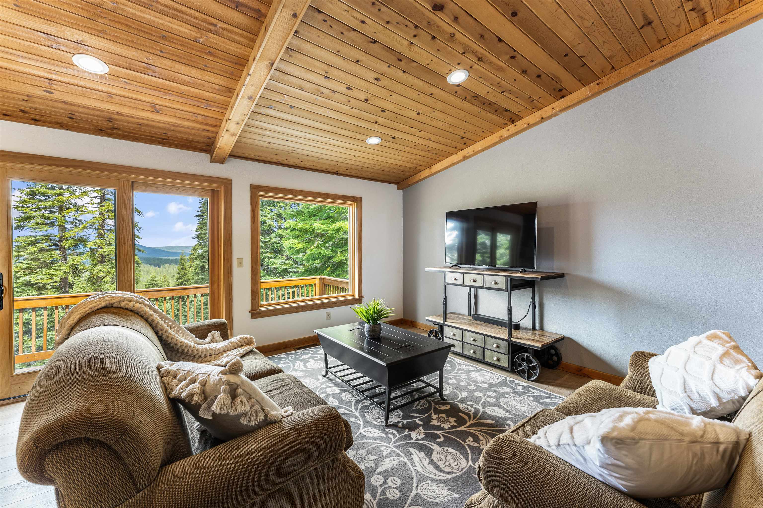 12185 Ski Slope Way Truckee, CA 96161 - Photo 2 of 27 a living room with furniture and a flat screen tv