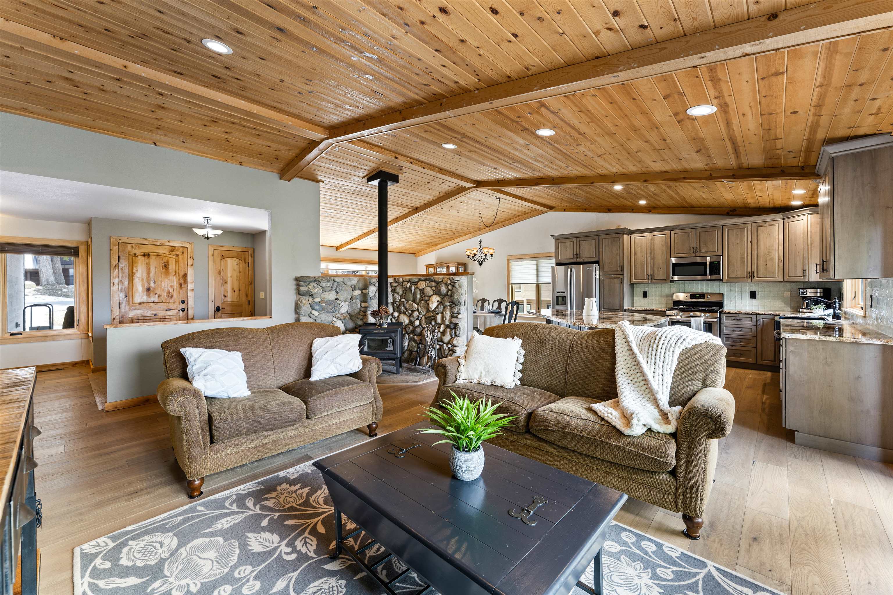 12185 Ski Slope Way Truckee, CA 96161 - Photo 3 of 27 a living room with furniture and kitchen view