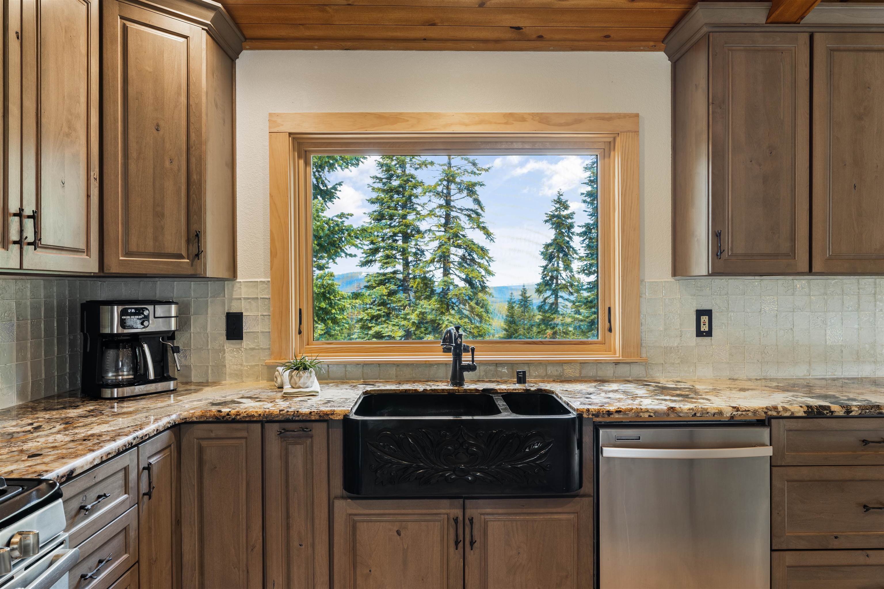12185 Ski Slope Way Truckee, CA 96161 - Photo 6 of 27 a kitchen with granite countertop a sink and a window