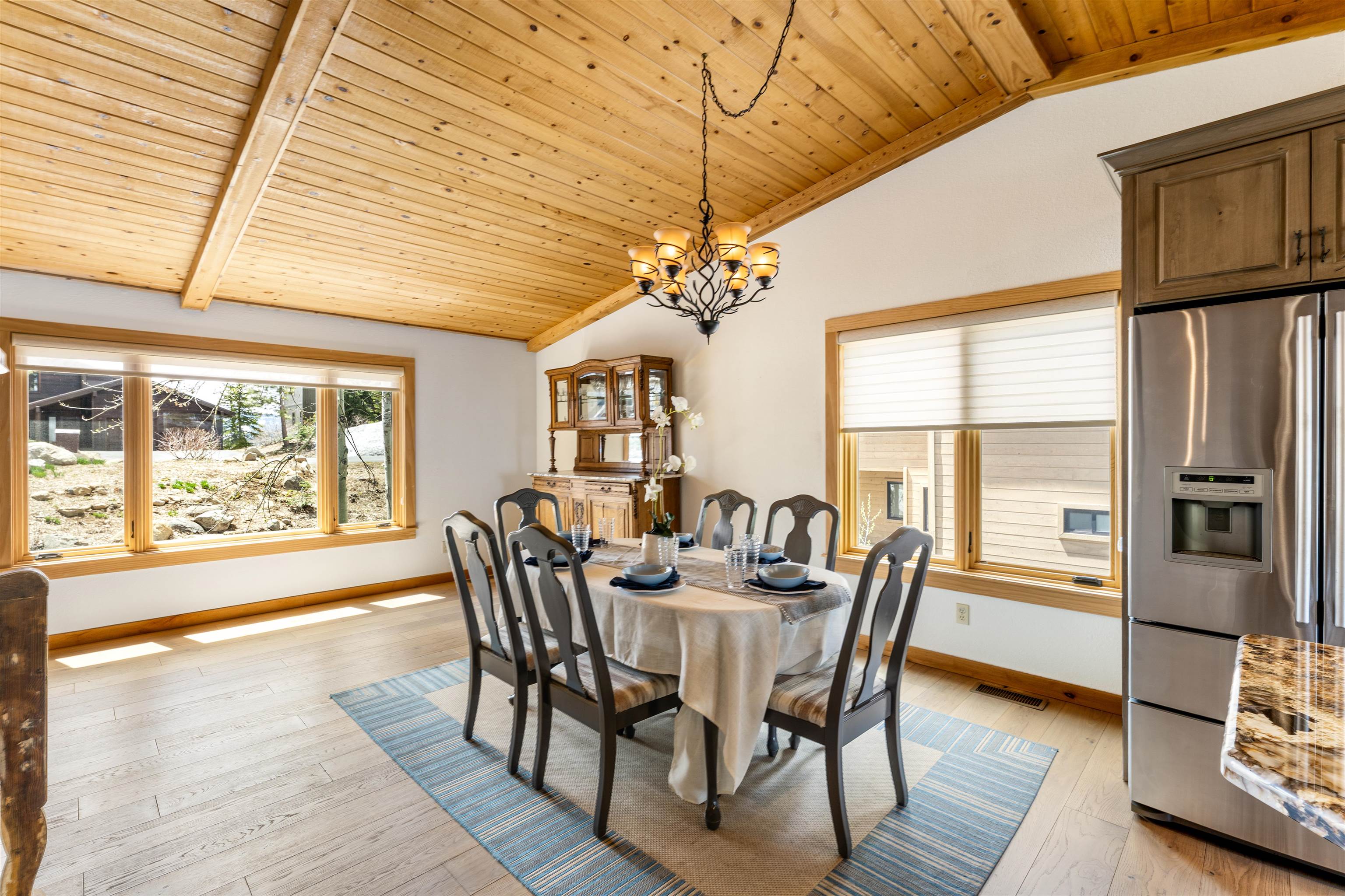 12185 Ski Slope Way Truckee, CA 96161 - Photo 7 of 27 a view of a dining room with furniture window and wooden floor