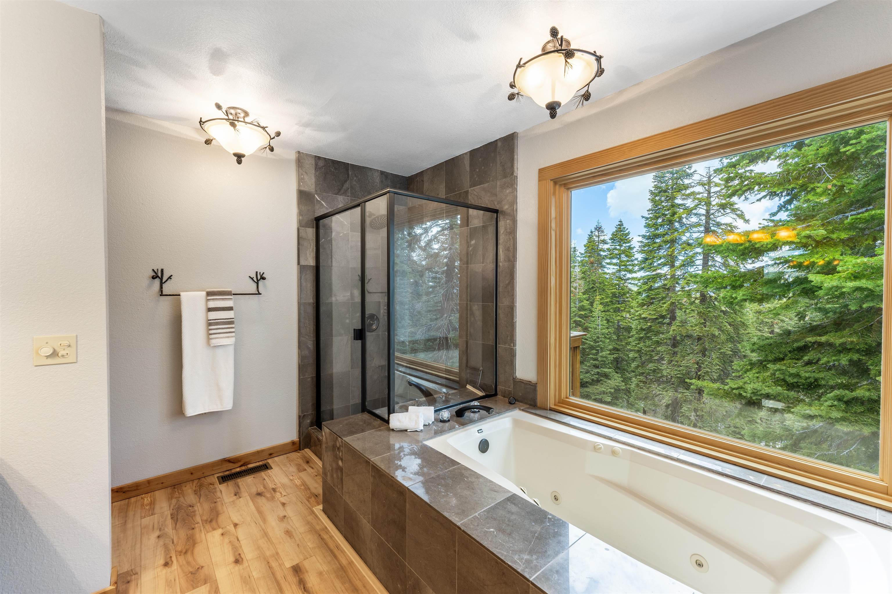 12185 Ski Slope Way Truckee, CA 96161 - Photo 10 of 27 a spacious bathroom with a large tub and shower