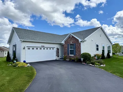 a view of a house with a back yard