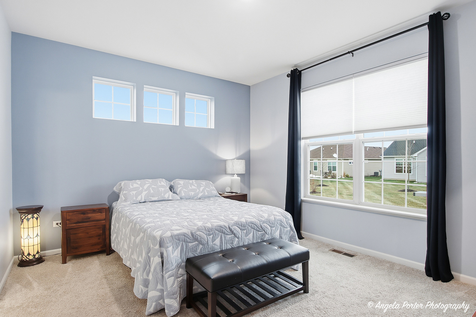 9186 Ritz Court Huntley, IL 60142 - Photo 11 of 36 a bedroom with a bed lamp and a window
