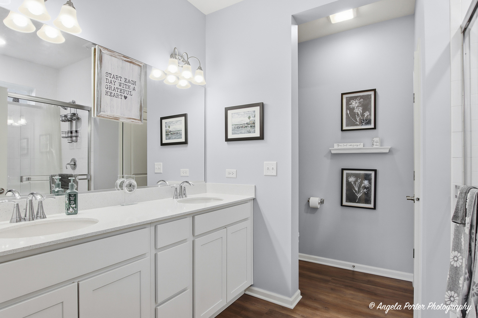 9186 Ritz Court Huntley, IL 60142 - Photo 13 of 36 a bathroom with double vanity sinks a mirror and a shower