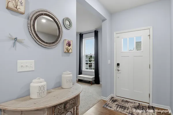 a bathroom with a toilet and a mirror