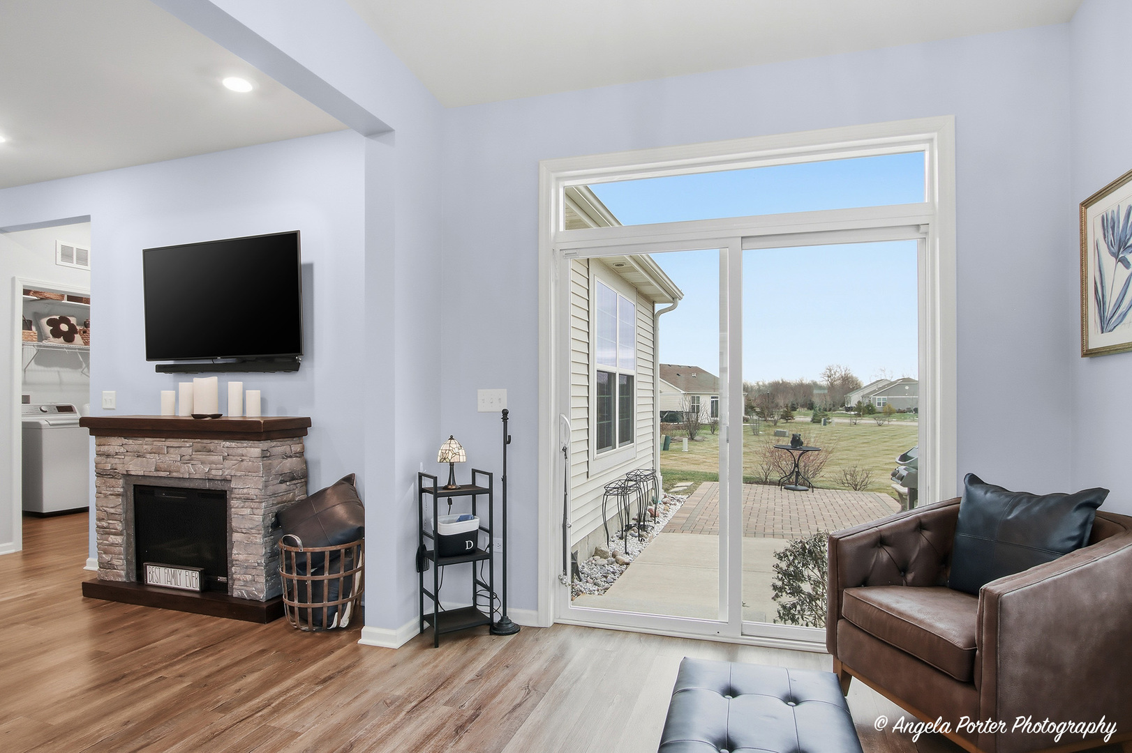 9186 Ritz Court Huntley, IL 60142 - Photo 8 of 36 a living room with furniture fireplace and flat screen tv