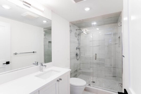 14 Atkins Street, Unit 2 Boston, MA 02135 - Photo 4 of 11 a bathroom with a sink shower and a mirror