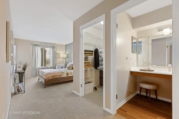 a view of a bedroom with a bed and a balcony