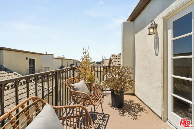a view of balcony with furniture