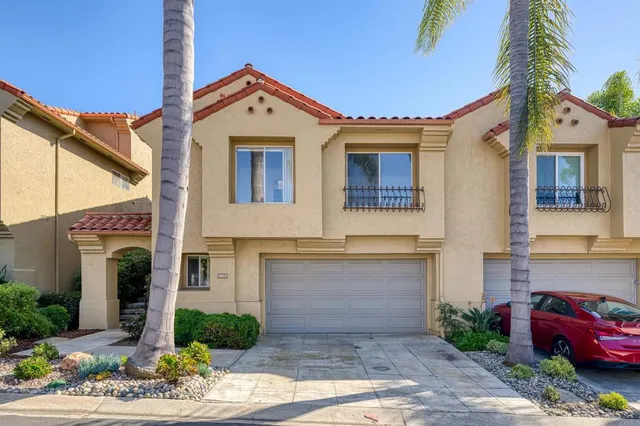 a front view of a house with yard