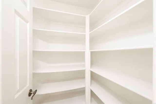 a view of empty room with floor to ceiling window