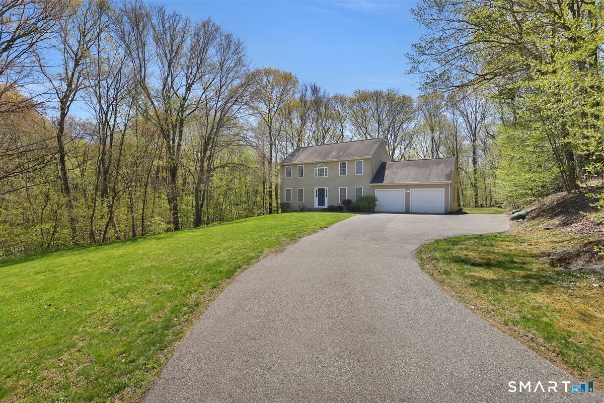 345 Hebron Road Andover, CT 06232 - Photo 36 of 39 a view of a house with a yard