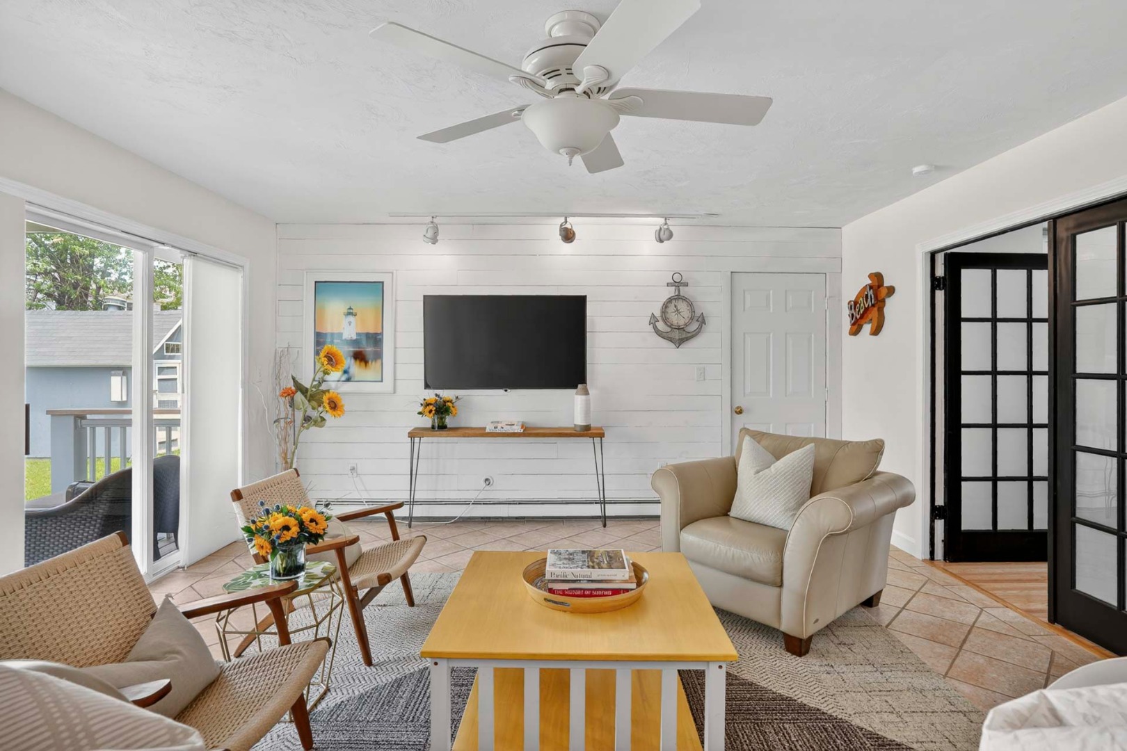 9 Thaxter Lane Edgartown, MA 02539 - Photo 40 of 53 a living room with furniture and a flat screen tv