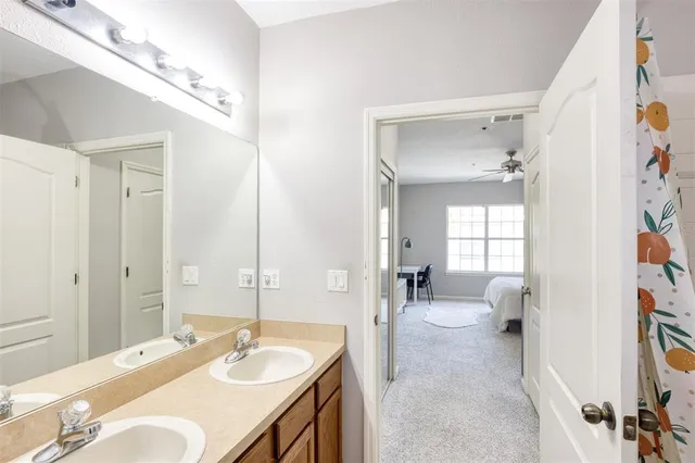 a spacious bathroom with a sink double vanity tub and shower