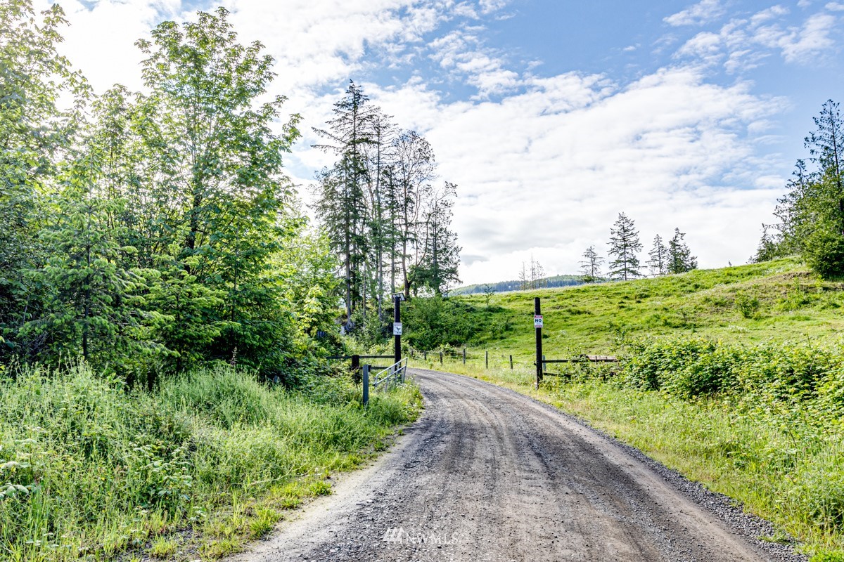 9999 Chicken Coop Road Sequim, WA 98382 - Photo 16 of 30 a view of a pathway with a yard
