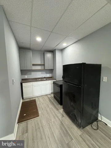 a kitchen with wooden cabinets and a stove
