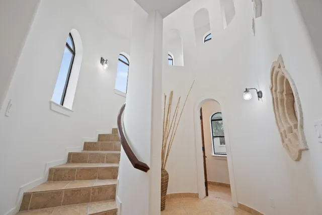 a view of staircase with white walls
