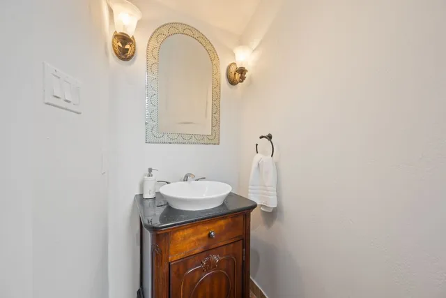 a close view of a sink and a mirror