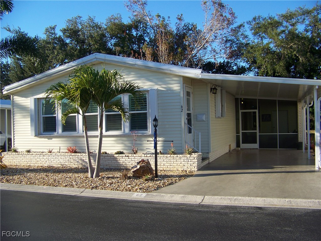 15550 Burnt Store Road, Unit 62 Punta Gorda, FL 33955 - Photo 1 of 50 a house with trees in the background