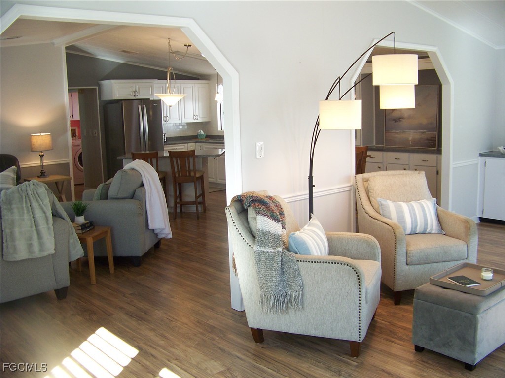 15550 Burnt Store Road, Unit 62 Punta Gorda, FL 33955 - Photo 11 of 50 a living room with furniture potted plant and a mirror