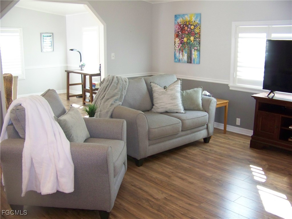 15550 Burnt Store Road, Unit 62 Punta Gorda, FL 33955 - Photo 12 of 50 a living room with furniture and a flat screen tv