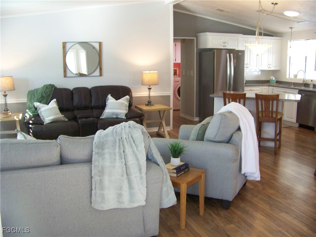 15550 Burnt Store Road, Unit 62 Punta Gorda, FL 33955 - Photo 15 of 50 a living room with furniture and a window