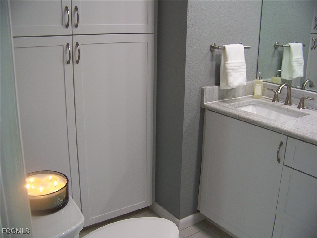 15550 Burnt Store Road, Unit 62 Punta Gorda, FL 33955 - Photo 34 of 50 a bathroom with a toilet and a sink