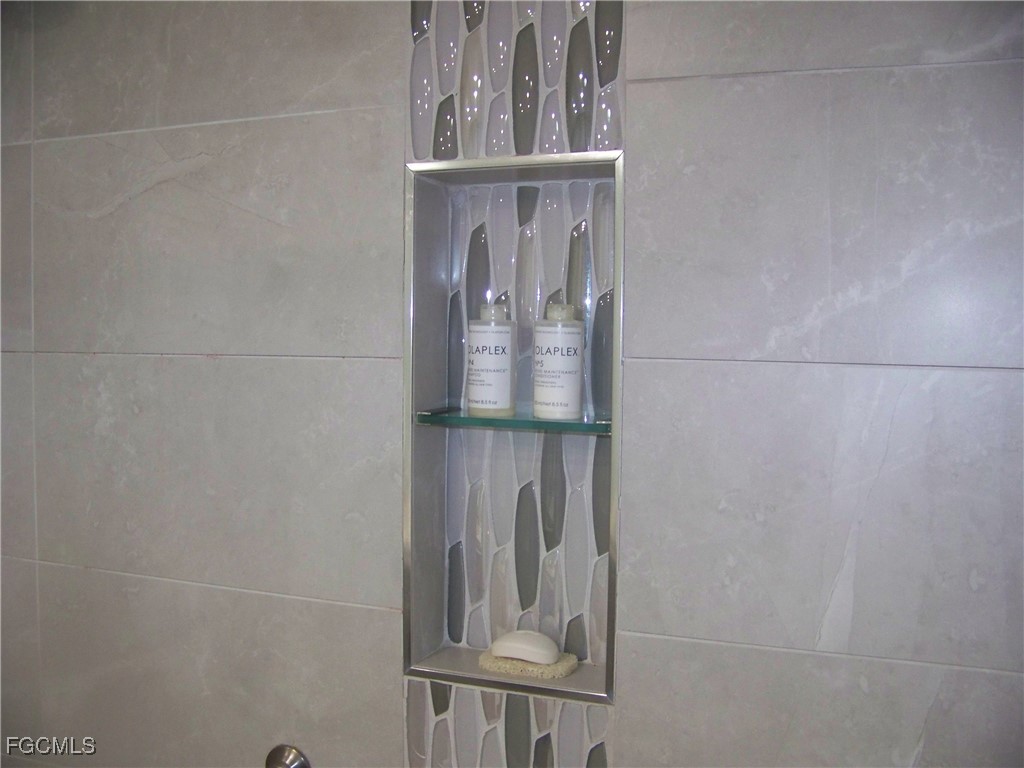 15550 Burnt Store Road, Unit 62 Punta Gorda, FL 33955 - Photo 37 of 50 a view of staircase with white walls