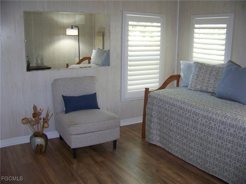 15550 Burnt Store Road, Unit 62 Punta Gorda, FL 33955 - Photo 38 of 50 a living room with furniture and a lamp