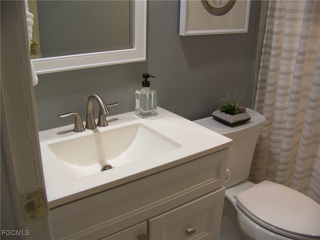 15550 Burnt Store Road, Unit 62 Punta Gorda, FL 33955 - Photo 40 of 50 a bathroom with a sink and a toilet