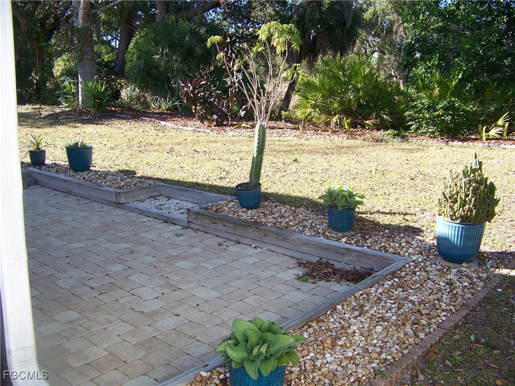 15550 Burnt Store Road, Unit 62 Punta Gorda, FL 33955 - Photo 4 of 50 a view of a yard with plants