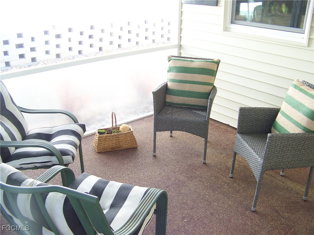 15550 Burnt Store Road, Unit 62 Punta Gorda, FL 33955 - Photo 7 of 50 a bedroom with furniture and window