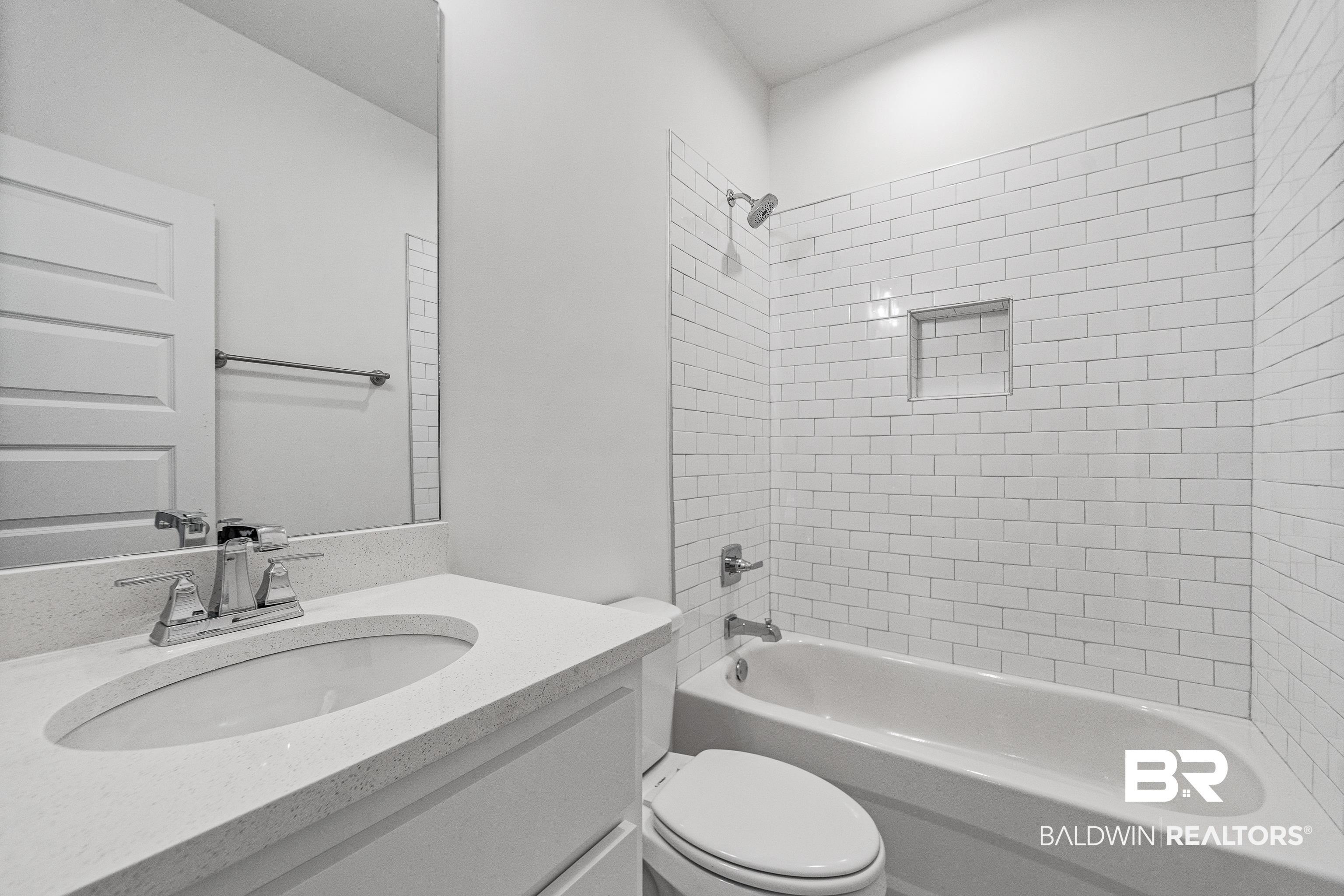 25927 Capra Court Daphne, AL 36526 - Photo 26 of 37 Full bathroom with tiled shower / bath combo, vanity, and toilet