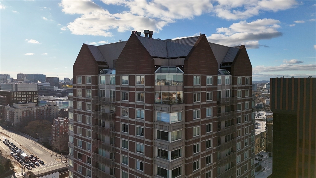 8 Museum Way, Unit 2304 Cambridge, MA 02141 - Photo 1 of 39 a front view of a residential apartment building with a yard