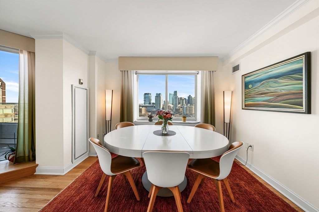 8 Museum Way, Unit 2304 Cambridge, MA 02141 - Photo 11 of 39 a view of a dining room with furniture window and wooden floor