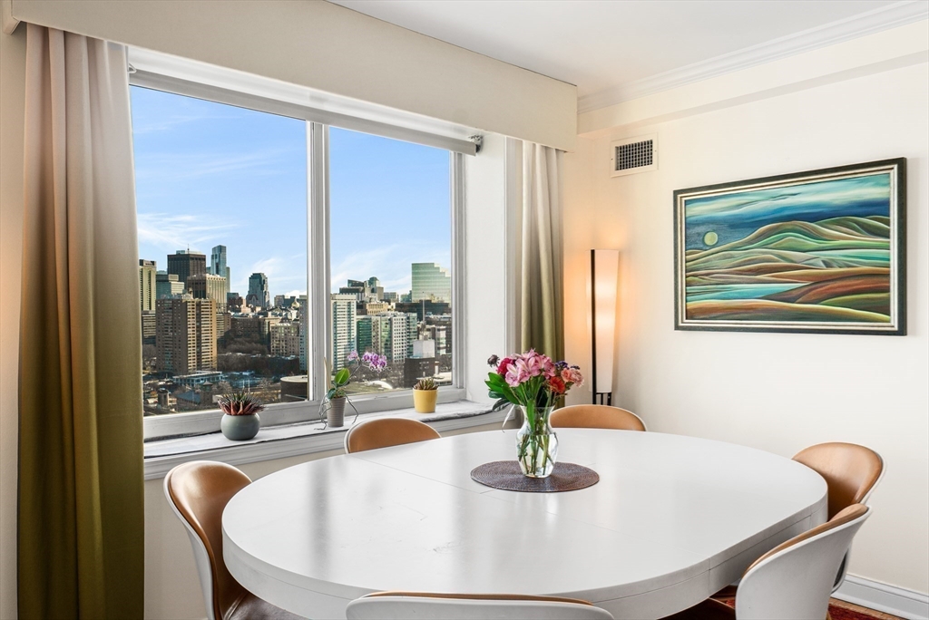 8 Museum Way, Unit 2304 Cambridge, MA 02141 - Photo 13 of 39 a dining room with furniture and wooden floor